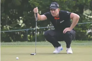  ?? The Associated Press ?? ■ Henrik Stenson, of Sweden, lines up a putt on the sixth green during the final round of the Valspar Championsh­ip golf tournament Sunday in Palm Harbor, Fla.