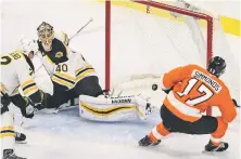  ?? AP PHOTO ?? LESS THAN STELLAR: Tuukka Rask allowed four goals in two periods and just 18 shots on Thursday night in Philadelph­ia, including this one by Wayne Simmonds.