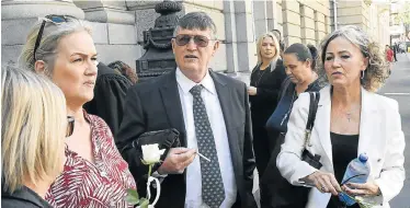  ?? Picture: BRENTON GEACH/GALLO IMAGES ?? BROKEN MAN: Hannah Cornelius’s father, retired magistrate Willem Cornelius, centre, arrives at the high court in Cape Town on Thursday before the sentencing of the men found guilty of raping and killing his daughter on May 27 2017