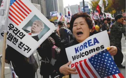  ?? (Kim Kyung-Hoon/Reuters) ?? SUPPORTERS OF US President Donald Trump take part in a rally in central Seoul yesterday.