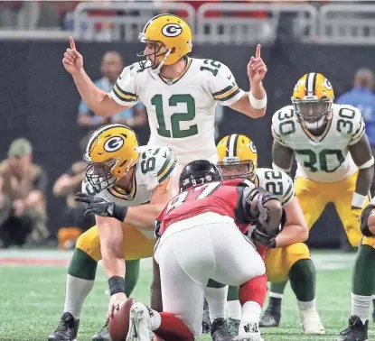  ?? JIM MATTHEWS / USA TODAY NETWORK ?? Quarterbac­k Aaron Rodgers says the Packers can beat any team at Lambeau Field, but the loss at Atlanta may keep Green Bay from hosting multiple playoff games.