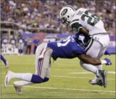  ?? JULIO CORTEZ — ASSOCIATED PRESS FILE ?? New York Giants’ Landon Collins (21) tackles New York Jets’ Matt Forte (22) during the first half of an Aug. 26 preseason NFL football game, in East Rutherford, N.J. A defense led by Collins can carry this team like it did a year ago.