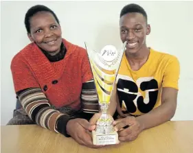  ?? Picture: SIKHO NTSHOBANE ?? WINNING ATTITUDE: Proud mother Gcobisa Mfono and her son Inga Mfono, 17. He recently won the Best Afro Pop Artist award at this year’s Eastern Cape Music Awards in East London last week.