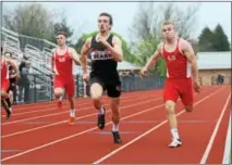  ?? AUSTIN HERTZOG - DIGITAL FIRST MEDIA ?? Boyertown’s Max Miller, center, beats Owen J. Roberts’ Corey Wright to the finish line to win the boys’ 200 meters.