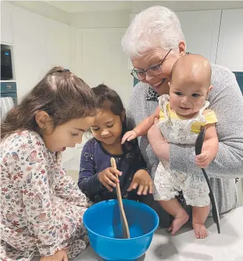  ?? ?? Griffith University Emeritus Professor Anneke Fitzgerald is bridging the gap between the young and old, and not just with grandchild­ren (from left) Lilly-janna, Brianna-rose and Miyana.