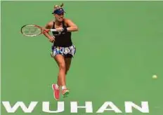  ?? AP ?? Angelique Kerber hits a forehand return to Kristina Mladenovic during the Wuhan Open in Wuhan in China.