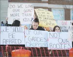  ?? AP PHOTO ?? Students at Pittsfield High School demonstrat­e for school safety in response to the school shooting in Parkland, Fla., Tuesday, in Pittsfield, Mass.