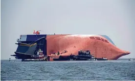  ?? ?? Oops … a US Coast Guard helicopter lifts crew from the Golden Ray, a 656ft vehicle carrier capsized in St Simons Sound, near Brunswick, Georgia, in 2019. Photograph: US Coast Guard