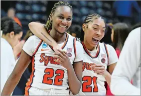  ?? JESSICA HILL/AP PHOTO ?? Syracuse forwards Kyra Wood (22) and Saniaa Wilson (21) celebrate at the end of Saturday’s first-round game against Arizona in the NCAA tournament in Storrs.