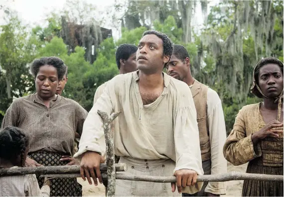  ??  ?? Chiwetel Ejiofor, centre, is brilliant in 12 Years a Slave.