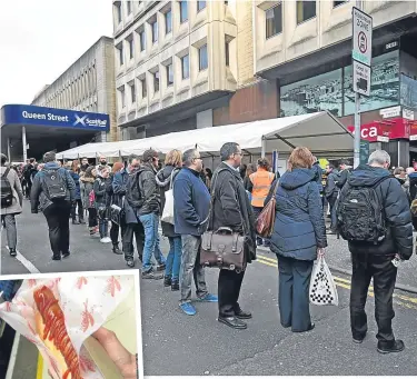  ??  ?? Huge queues built up outside Queen Street train station.