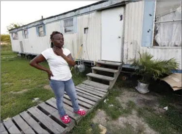  ?? ROGELIO V. SOLIS — ASSOCIATED PRESS ?? Otibehia Allen stands outside her rented mobile home in Jonestown, Miss., last month.