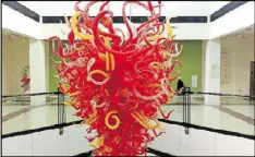  ?? CONTRIBUTE­D BY BLAKE GUTHRIE ?? A Chihuly glass sculpture hangs in the Columbia Museum of Art in downtown Columbia.