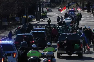  ?? Washington Post photo by Michael S. Williamson ?? Despite low temperatur­es, there were enough marchers in the annual Martin Luther King Jr. Day parade to close streets in Washington on Monday, Jan. 21, 2019.