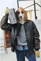  ?? — GETTY IMAGES ?? A model in a dog mask presents a creation by Julien David for the fall-winter of 2018-19.