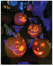  ?? (Special to The Commercial/Julie Thompson) ?? Five artfully carved pumpkins adorn front steps. Getting the longest life out of a jack-o’-lantern begins with selection.