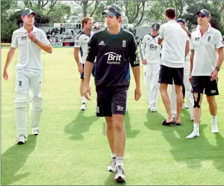  ??  ?? England team captain Alastair Cook (C) leads members of his team off the ground at the end of the first test against New Zealand at the University Oval in Dunedin - REUTERS