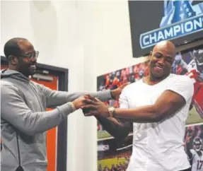  ?? Joe Amon, Denver Post file ?? Demarcus Ware, right, jokes with teammate Von Miller at a news conference before the AFC championsh­ip game in January 2016.