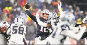  ?? Tom Fox / TNS ?? New England Patriots quarterbac­k Tom Brady throws a pass as he’s pressured by Dallas Cowboys middle linebacker Jaylon Smith in the third quarter at Gillette Stadium in November.