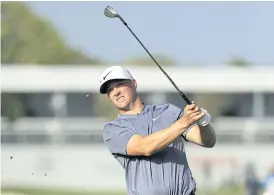  ??  ?? Alex Noren hits his approach shot on the 13th hole.