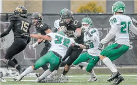  ?? GARY YOKOYAMA THE HAMILTON SPECTATOR FILE PHOTO ?? Will the
St. Thomas More Knights, seen here winning the Golden Horseshoe Bowl last November behind the running of Jawaun Smith (23), get a chance to prove they are the nation’s best high school football team yet again?