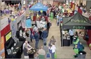  ?? Doug Walker / Rome News-Tribune ?? Business is brisk at the Business Expo in the Forum River Center.