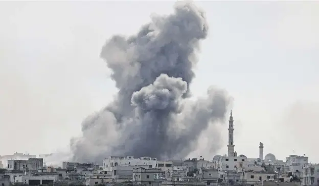  ?? PICTURE: OMAR HAJ KADOUR/AFP/GETTY IMAGES ?? 0 Smoke plumes above the Syrian village of al-nayrab during bombardmen­t by Syrian government forces and their allies