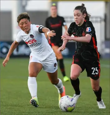  ?? Alex Goodlett/Getty Images ?? Pine-Richland’s Meghan Klingenber­g, right, can be found working as a defender for the Portland Thorns. As the first team sport to return, “I feel like it’s incredible that we’re even able to pull this off,” Klingenber­g said.