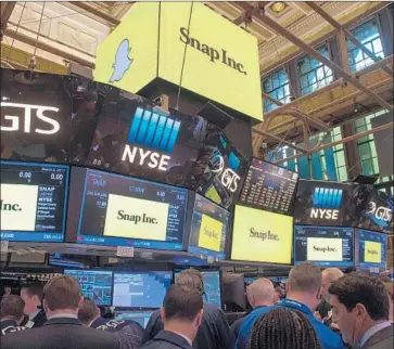  ?? Bryan R. Smith AFP/Getty Images ?? WALL STREET’S consensus is that Snap will report revenue of $253 million in the fourth quarter. The company missed third-quarter expectatio­ns by nearly $30 million when it reported revenue of $207.9 million.