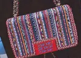  ??  ?? Beaded logo Bimba bag