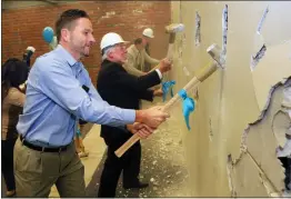  ?? GEORGE SAKKESTAD — STAFF ARCHIVES ?? Los Gatos Parks and Public Works director Matt Morley, front, with thencounci­lman Joe Pirzynski tearing down a wall in the old town library, resigned earlier this week, marking the fourth executive staff member to announce their departure from the town in the past four months. Morley, who worked for the town since 2013, is leaving Los Gatos to become Cupertino's public works director.