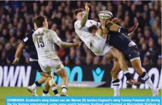  ?? ?? EDINBURGH: Scotland’s wing Duhan van der Merwe (R) tackles England’s wing Tommy Freeman (C) during [OL :P_ 5H[PVUZ PU[LYUH[PVUHS Y\NI` \UPVU TH[JO IL[^LLU :JV[SHUK HUK ,UNSHUK H[ 4\YYH`ÄLSK :[HKP\T PU Edinburgh, Scotland. — AFP