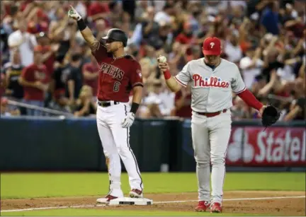  ?? RICK SCUTERI — THE ASSOCIATED PRESS ?? Arizona Diamondbac­ks’ David Peralta (6) celebrates after hitting an RBI triple against the Phillies in the third inning Wednesday in Phoenix.