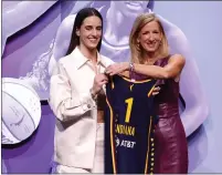  ?? SARAH STIER — GETTY IMAGES/TNS ?? Caitlin Clark poses with WNBA Commission­er Cathy Engelbert after being selected as the first overall pick by the Indiana Fever.