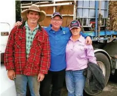  ??  ?? Stu Haw, Tim Newell and Katrina Wood ready to donate some hay to farmers in Mingoola.