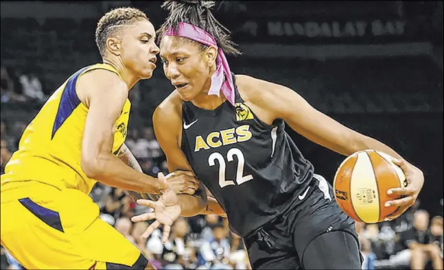  ?? Las Vegas Review-Journal ?? Aces center A’ja Wilson, shown driving against Fever forward Candice Dupree on Aug. 11 at Mandalay Bay Events Center, was named WNBA Rookie of the Year last year. Entering her second season, she said of the team, “We’re coming in stronger. … I’m excited to get back to work.” Training camp opens Sunday at Cox Pavilion.