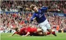  ?? Paul Ellis/AFP/Getty Images ?? Steven Gerrard fouls Everton’s Kevin Kilbane, earning a second yellow card in the Merseyside derby back in 2006. Photograph: