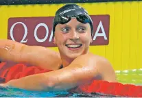  ?? DARKO BANDIC/ASSOCIATED PRESS FILE PHOTO ?? Katie Ledecky reacts after winning the gold medal in the women’s 1,500-meter freestyle final in July during the swimming competitio­ns of the World Aquatics Championsh­ips in Budapest, Hungary. Ledecky was named Tuesday as The Associated Press Female...