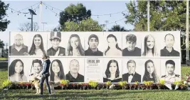  ?? MATIAS J. OCNER mocner@miamiheral­d.com | Feb. 14, 2022 ?? These photos at Pine Trails Park in Parkland honor the 17 students and staffers who were killed at Marjory Stoneman Douglas High School in 2018. The shooter was spared the death penalty because three of the 12 jurors voted against it.