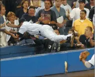  ?? FRANK FRANKLIN II ?? FILE - In this July 1, 2004, file photo, New York Yankees Derek Jeter dives to catch a fly foul ball in the 12th inning during a baseball against the Boston Red Sox at New York’s Yankee Stadium. Jeter could be a unanimous pick when Baseball Hall of Fame voting is announced Tuesday.