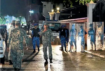  ?? PHOTO: AP ?? Soldiers and riot police patrol the main street of the Maldives capital, Male, after the government declared a 15-day state of emergency.