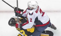  ?? GENE J. PUSKAR/THE ASSOCIATED PRESS ?? The Pittsburgh Penguins say Sidney Crosby has a concussion after taking a crosscheck from Washington Capitals defenceman Matt Niskanen during Monday’s game in Pittsburgh.