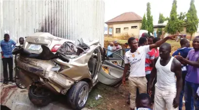  ??  ?? Sympathise­rs gather at the scene of the accident near NYSC Junction on Kubwa-Zuba expressway yesterday