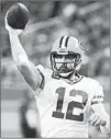  ?? RICK OSENTOSKI/AP ?? Packers QB Aaron Rodgers sports a 9-7 playoff record while passing for 36 TDs in his career.