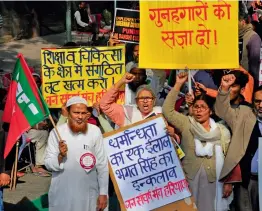  ?? — BUNNY SMITH ?? Muslims take out a protest rally on the occasion of 25th anniversar­y of Babri mosque demolition in New Delhi on Wednesday.