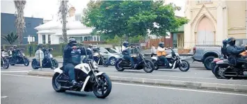  ?? ?? About 200 bikers rode along Ponsonby Rd behind a hot rod American classic ute carrying a casket.