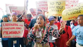  ??  ?? An indigenous person addresses supporters after rushing closer to the venue of a mining conference to protest alleged incursion of big mining companies into their ancestral lands in Manila on Sept. 6. (AP)