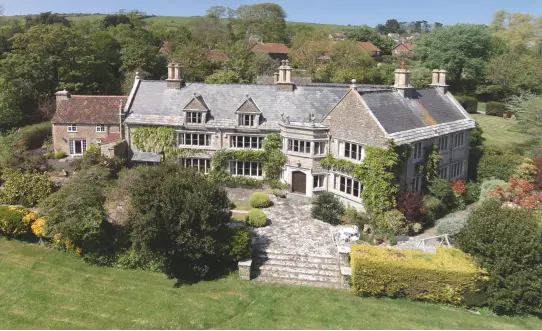  ??  ?? Handsome stone Norburton Hall at Burton Bradstock currently includes a successful holiday let and B&B business. £2.5m