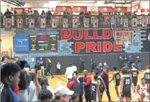  ?? Logan Maddox ?? Cedartown and Rockmart shook hands at the end of a big win for the Bulldogs on their home court on Saturday, Dec. 14.