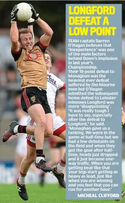  ?? SPORTSFILE ?? Rising above it all: Down captain Darren O’Hagan